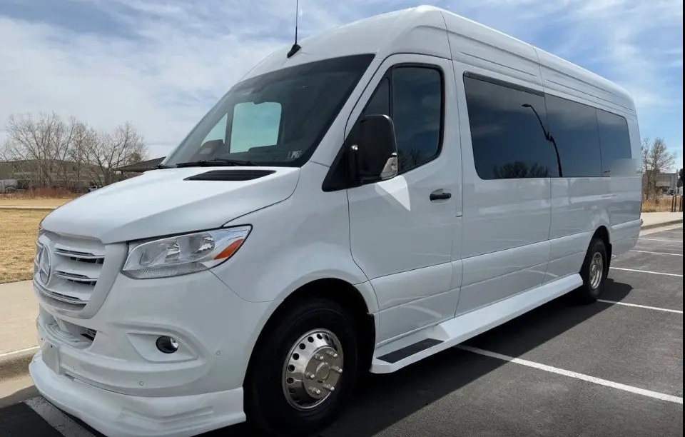 Golden 16 passenger white Sprinter limo bus
